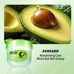 Moisturizing avocado lip balm in a small green jar with hydrating avocado fruit background