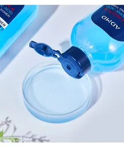 Detail macro view of ADMD collagen and hyaluronic acid toner pouring into petri dish.