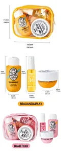Travel toiletry set with body wash, mist, and body butter in yellow and pink bags