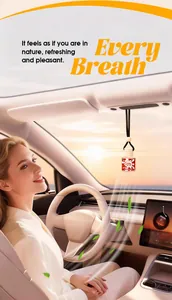 Detail showing a car perfume pendant hanging in a modern vehicle interior at sunset