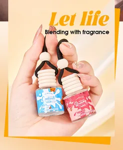 Close-up view of FORMBO car air freshener glass bottles with wooden caps and hanging cords.