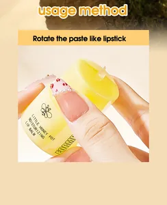 Detailed macro shot of FORMBO Little Honey Pot moisturizing lip balm texture and usage