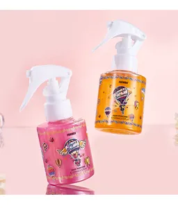Vue détaillée des flacons de parfum pour cheveux FORMBO rose et or scintillants.