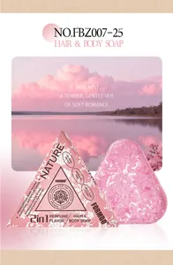 Detail of FORMBO pink fragrance bath soap with triangular packaging and a sunset lake