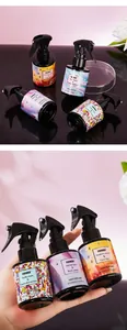 Detail view of FORMBO hair perfume bottles with colorful labels and 100ml spray heads