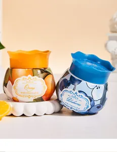 Désodorisants au baume d'aromathérapie en pots décoratifs sur les thèmes de l'orange et du bleuet.