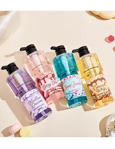 Macro view of four colorful FORMBO candy-style perfume shower gel bottles on cream background