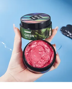 Close-up of FORMBO red and green temporary hair color wax in open and closed jars.