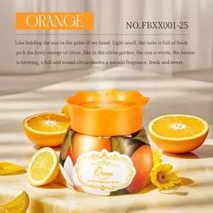 Macro detail view of orange scent air freshener jar featuring fresh citrus fruit ingredients