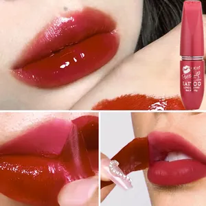 Demonstration of the application and film removal process of a red peel-off lip stain.
