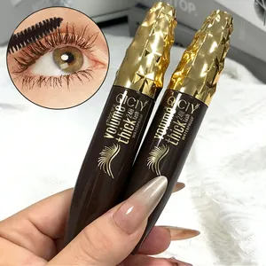 Macro detail of QICIY brown waterproof mascara tubes showing the applied lash effect