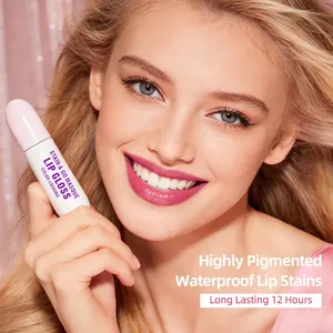 Close-up of highly pigmented waterproof lip stain application on model with tube