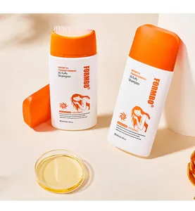 Detail van FORMBO shampoo fles met unieke borstel applicator en gouden vloeistof