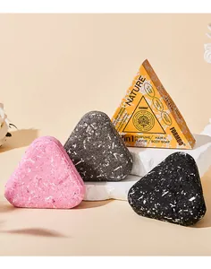 Triangular FORMBO perfume soaps in pink, grey, black with orange gift packaging box