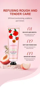 Close-up detail of white peach moisturizing hand cream for repairing dry skin texture.