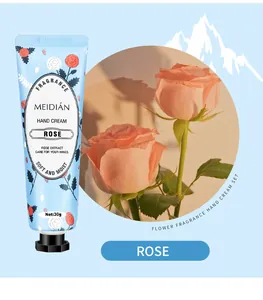 Detail view of the rose fragrance hand cream tube featuring a beautiful floral inset image