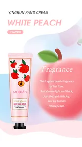 Moisturizing white peach fragrance hand cream detail view with soft pink background