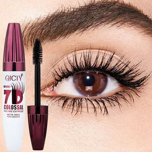 Close-up of mascara brush and long volumized eyelashes showing the 7D makeup effect