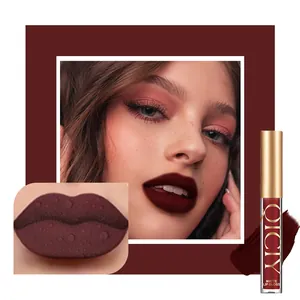 Close-up of dark red matte lip gloss showing waterproof texture and model application