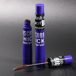 Close-up of QICIY waterproof brown mascara showing the brush wand and purple packaging detail