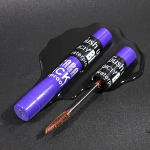 Detailed macro view of QICIY waterproof mascara brush and brown creamy formula for lashes