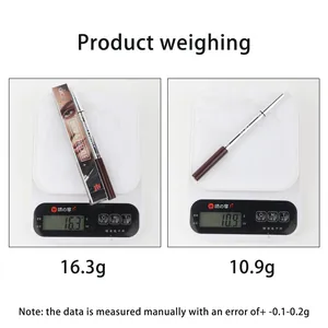 Digital scale showing weight of QICIY double-ended eyebrow gel and freckle pen in grams.