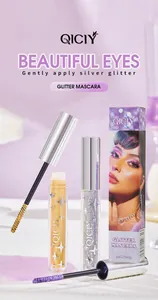 Professional detail shot of QICIY glitter mascara with gold and purple tubes and box