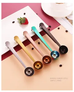 Detailed view of colorful stainless steel coffee scoops with integrated bag clips