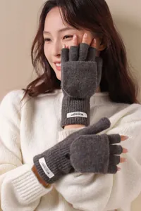 Model wearing dark gray 100% wool flip-top fingerless gloves for winter warmth