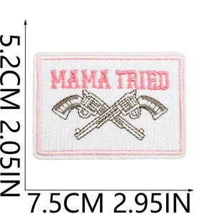 Western style embroidered patch featuring Mama Tried text and crossed revolvers design