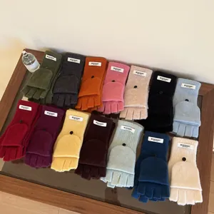 Variety of 100% wool flip-top knitted fingerless winter gloves in multiple colors.
