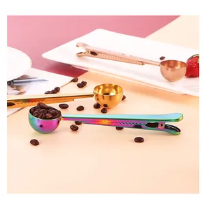 Macro detail of multicolored stainless steel coffee scoops with integrated bag clips