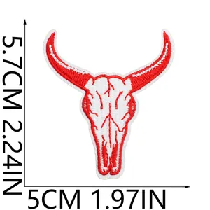 Detailed view of red and white cow skull embroidered patch with 5.7cm x 5cm dimensions