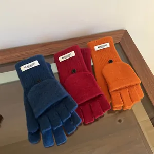 Detailed macro view of 100% wool convertible flip top gloves in three vibrant colors.