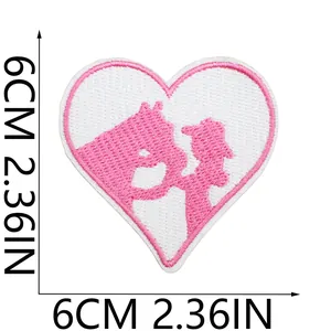Detail view showing 6cm x 6cm dimensions of pink heart cowgirl embroidery patch.