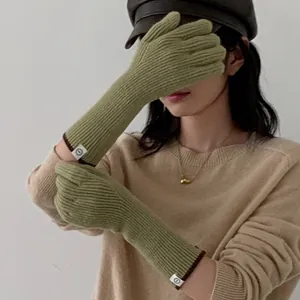 Elegant olive green long knitted winter gloves with stylish wrist label detail