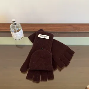 Detail view of premium 100% wool flip-top knitted winter gloves in dark brown finish