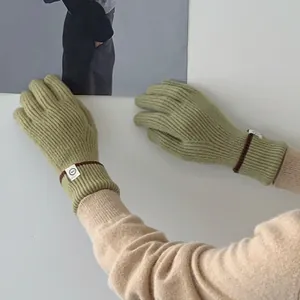 Stylish sage green ribbed knit gloves with contrasting patch detail for winter warmth