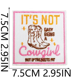 Close-up of a 7.5cm square embroidered patch featuring cowgirl boots and text.