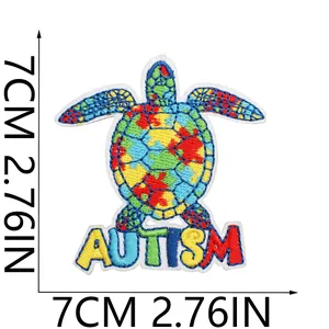 Detailed embroidery of colorful autism turtle patch measuring 7cm by 7cm