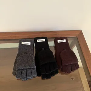 Detail view of 100% wool fingerless gloves with flip-top mittens in three classic colors