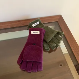 Detailed view of 100% wool knitted convertible mittens with functional flip-top design