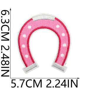 Macro detail of pink horseshoe embroidered patch with clear dimensions 6.3cm by 5.7cm