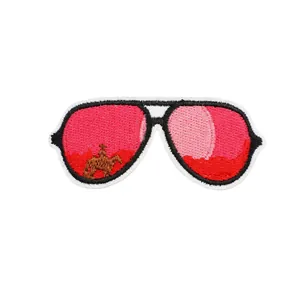Pink aviator sunglasses embroidered patch with western cowboy and horse sunset design.
