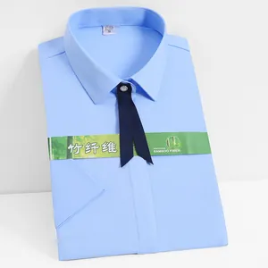 Light blue women's short-sleeved bamboo fiber business shirt with dark bow tie