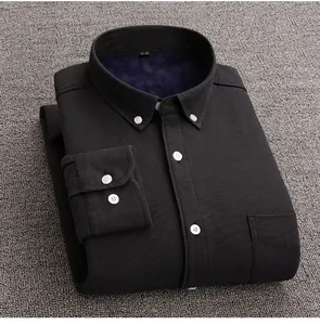 Close-up detail of a men's black fleece-lined Oxford shirt showing the warm interior texture.