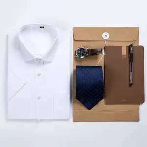 Men's short sleeve white dress shirt in professional flat lay with business accessories.