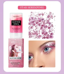 Close-up detail and application of MEIDIAN pink star glitter stick for face and body