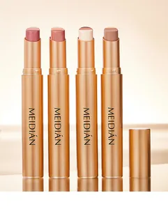 Detailed view of four dual-color gradient eyeshadow sticks in metallic gold cases.
