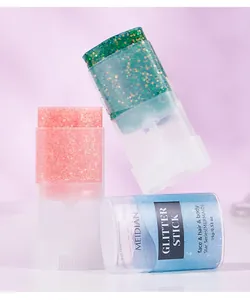 Close-up of MEIDIAN glitter sticks showing colorful sparkling paste for face and body.